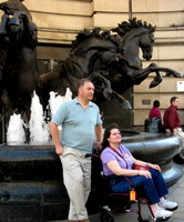 Nick and Nina taking a break near a fountain in London